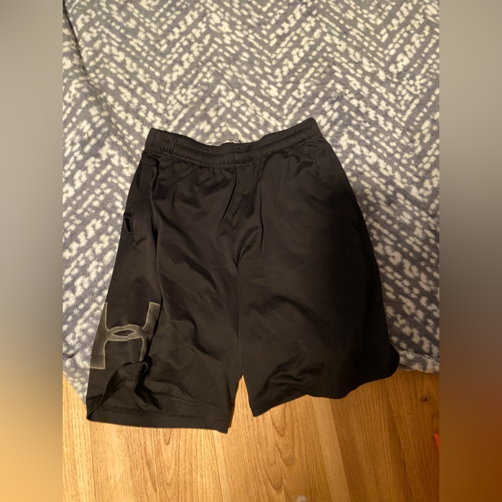 Medium Black UnderArmor shorts.